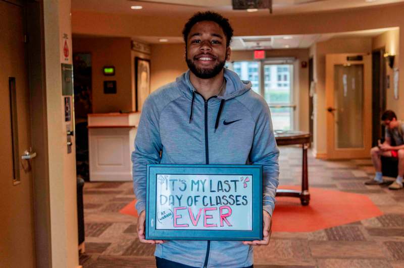 a man holding a sign
