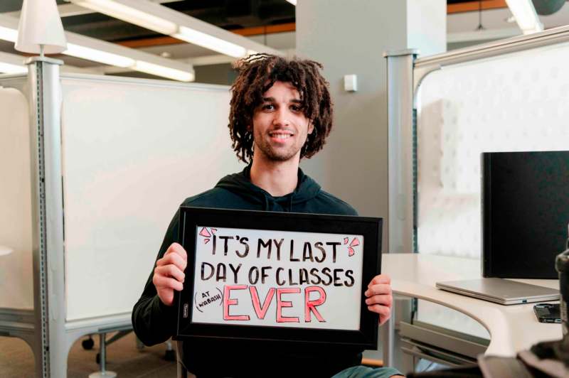 a man holding a sign