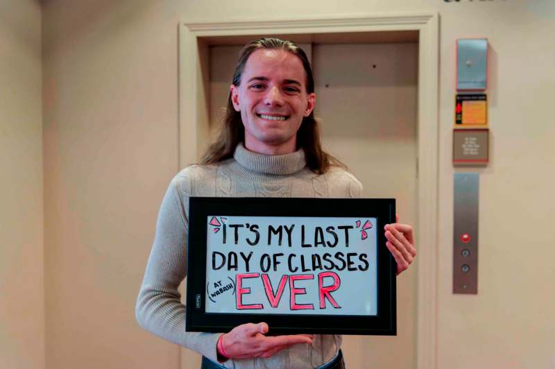 a man holding a sign