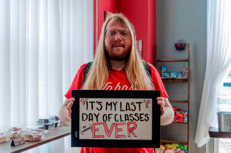 a man holding a sign