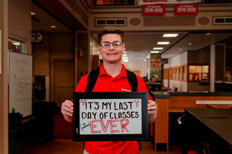 a man holding a sign