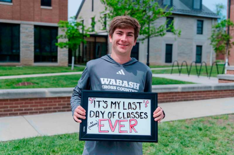 a man holding a sign