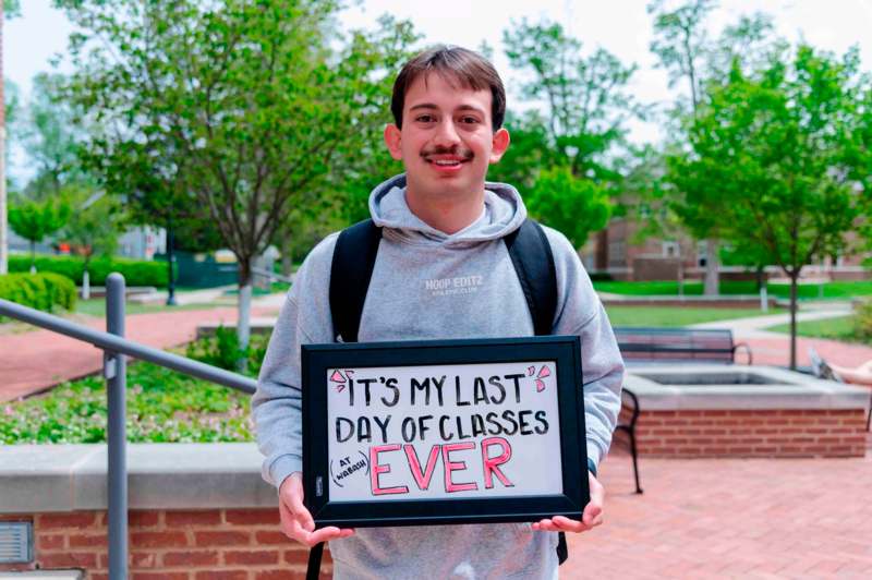 a man holding a sign
