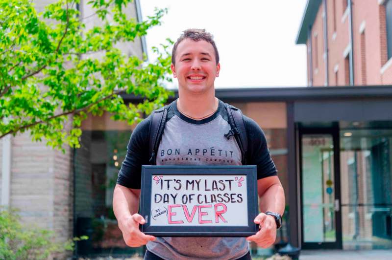 a man holding a sign