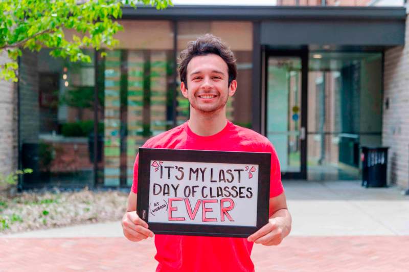 a man holding a sign