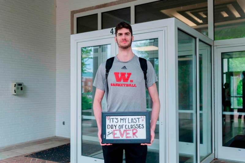 a man holding a sign