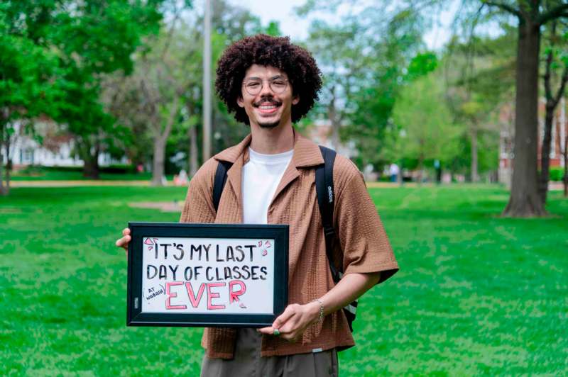 a man holding a sign