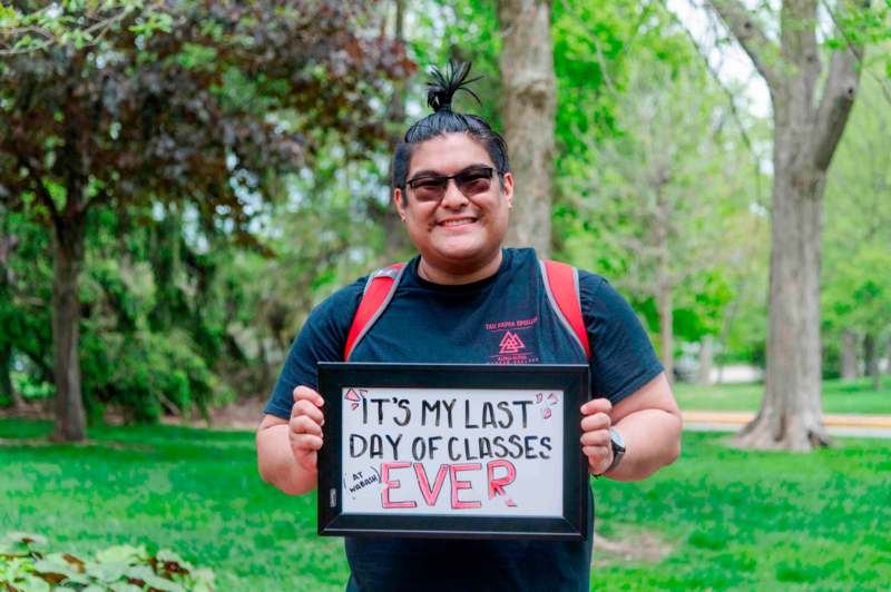 a man holding a sign