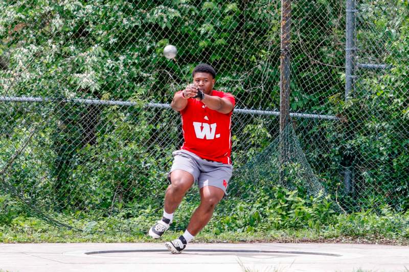 a man hitting a ball with a racket
