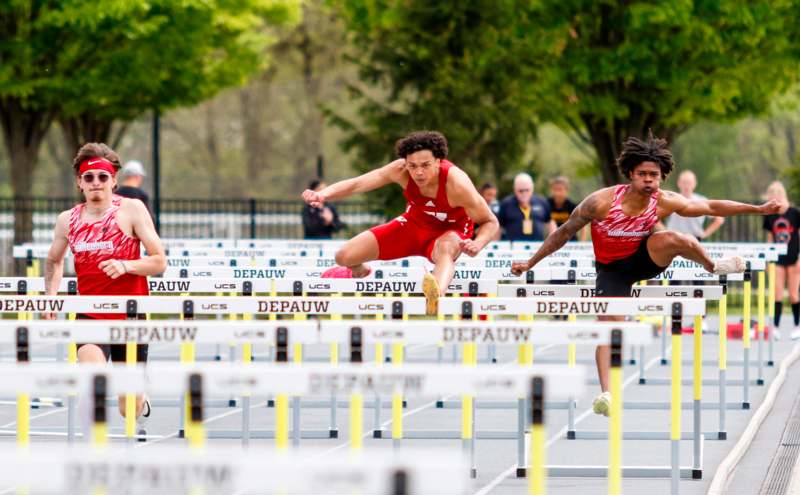 a group of people running on a track