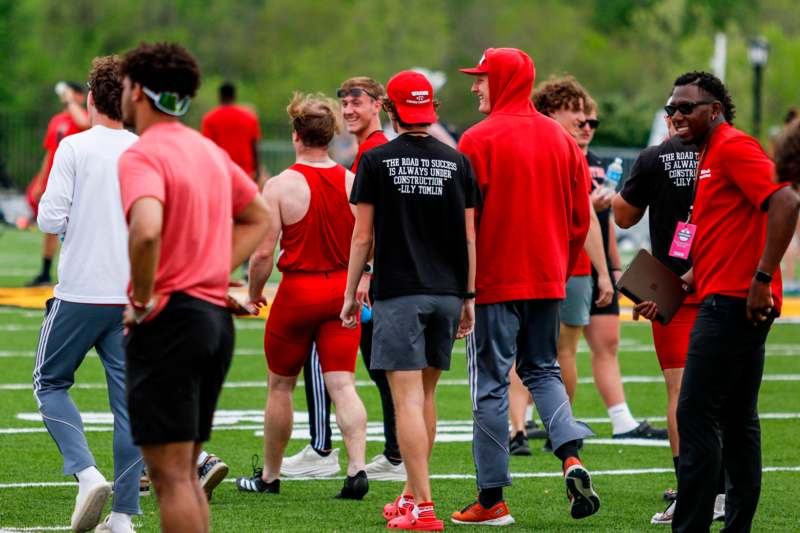 a group of people on a football field