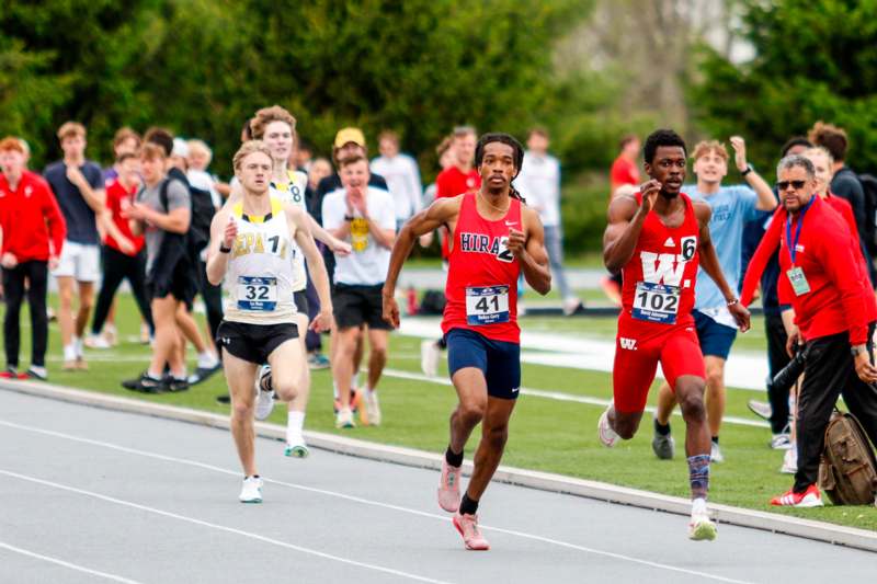 a group of people running on a track
