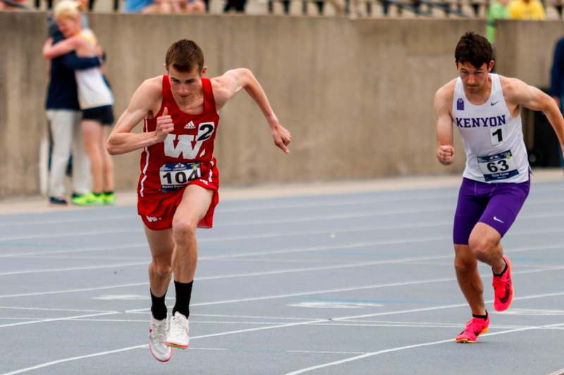 a group of people running on a track