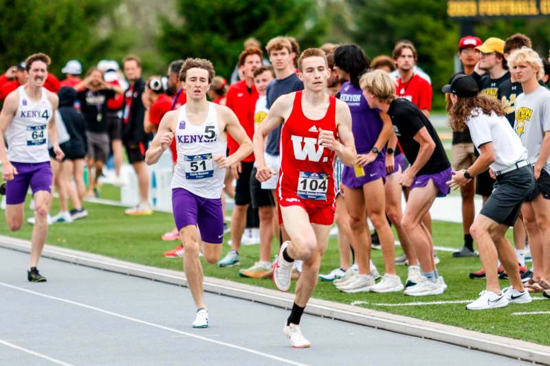 a group of people running on a track