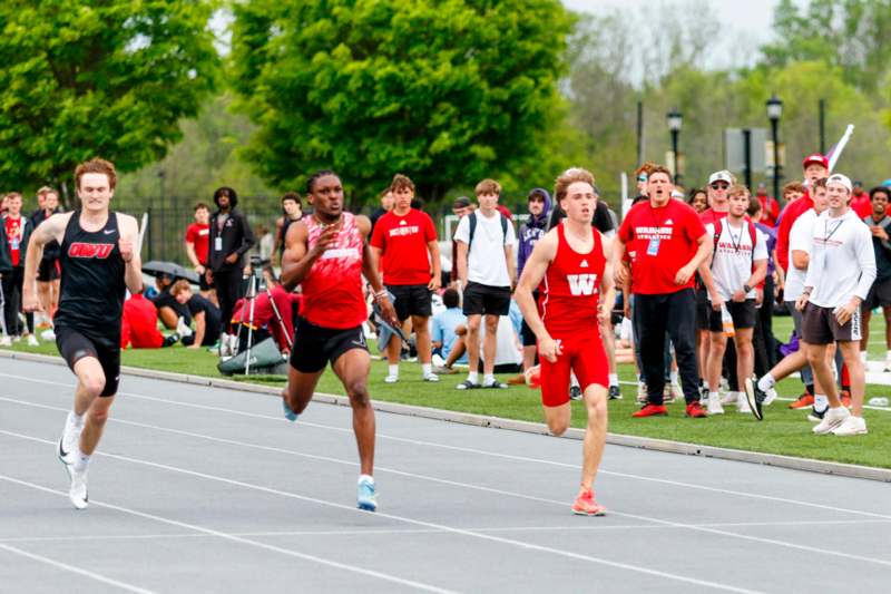 a group of people running on a track