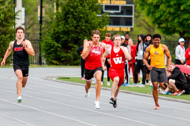 a group of people running on a track