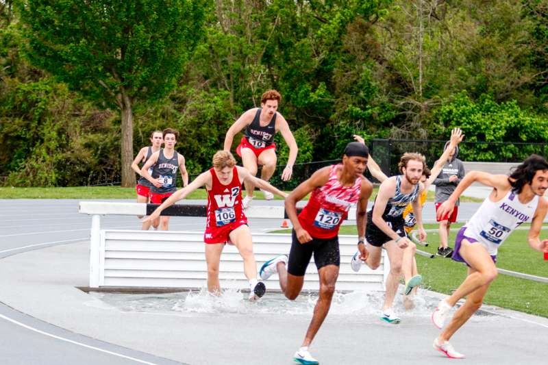 a group of people running on a track