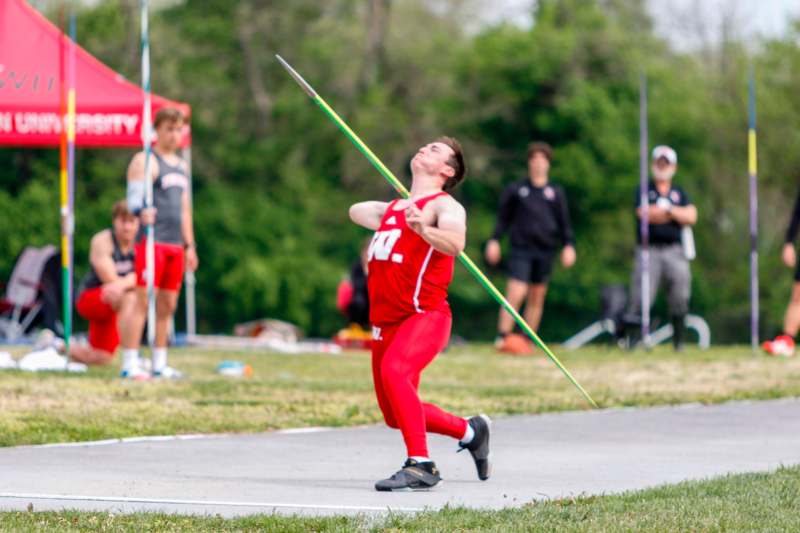 a man throwing a javelin
