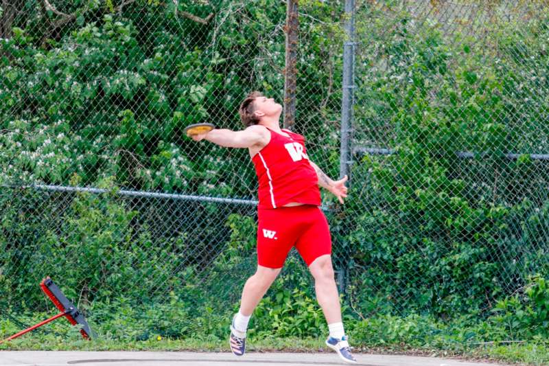 a man throwing a disc