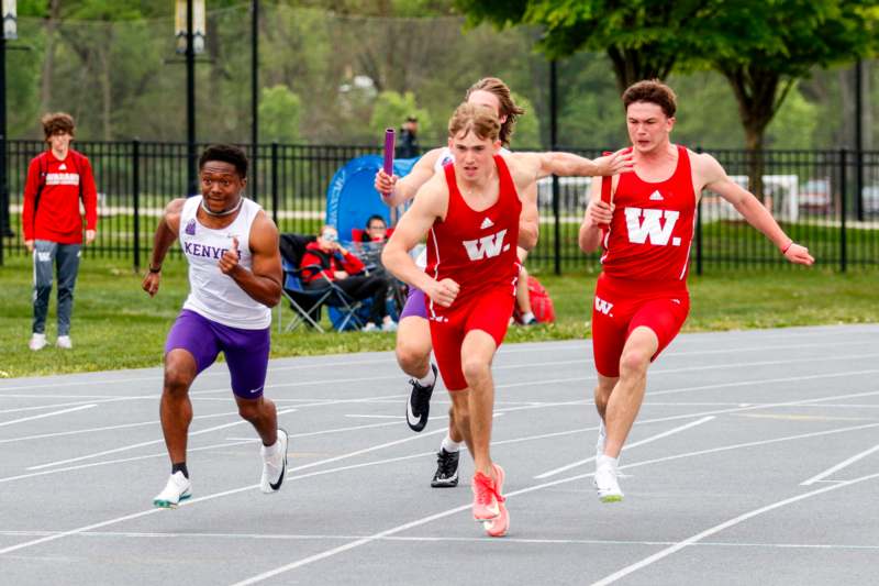 a group of men running on a track