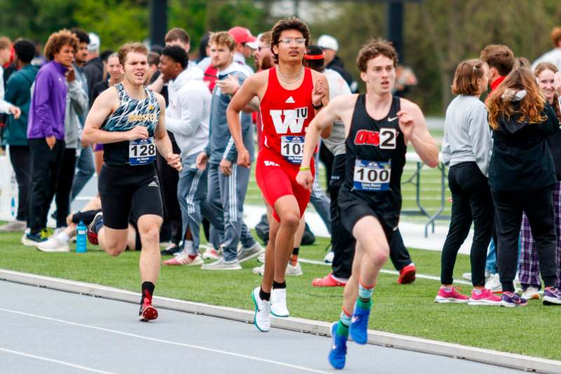 a group of people running on a track