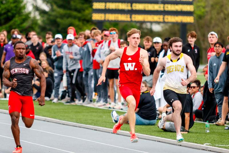 a group of men running on a track