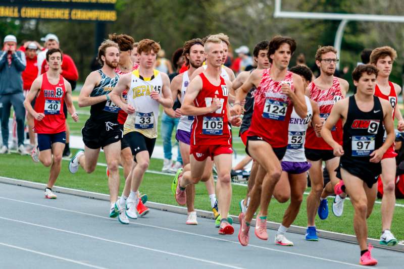 a group of people running on a track