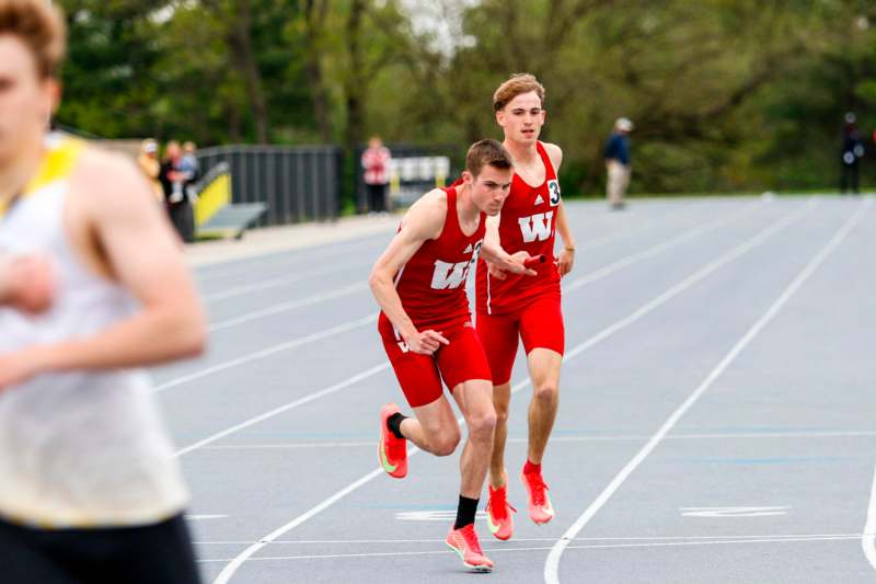two men running on a track