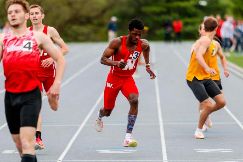 a group of people running on a track