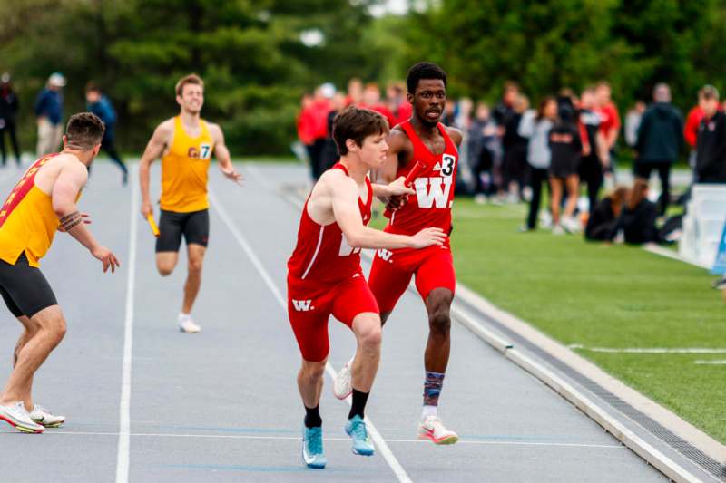 a group of people running on a track