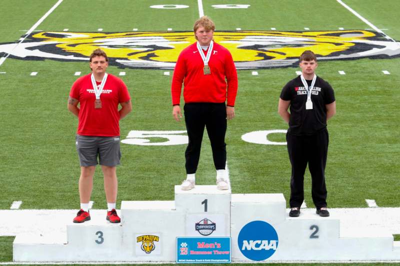 a group of men standing on a podium