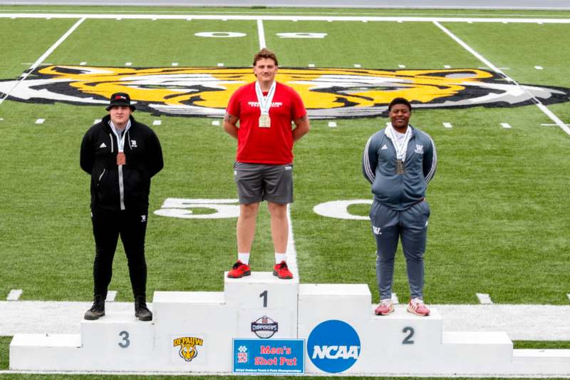a group of men standing on a podium