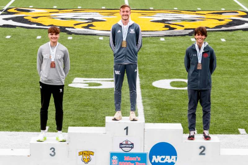 a group of men standing on a podium