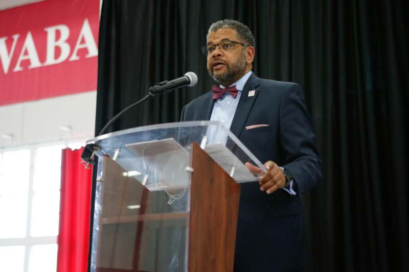 a man standing at a podium