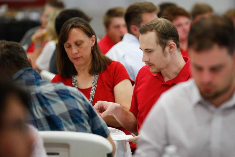 a group of people sitting at tables