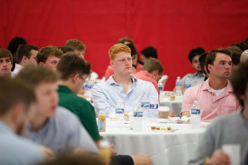 a group of people sitting at tables