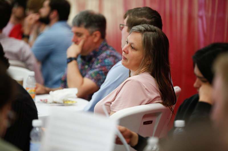 a group of people sitting at a table