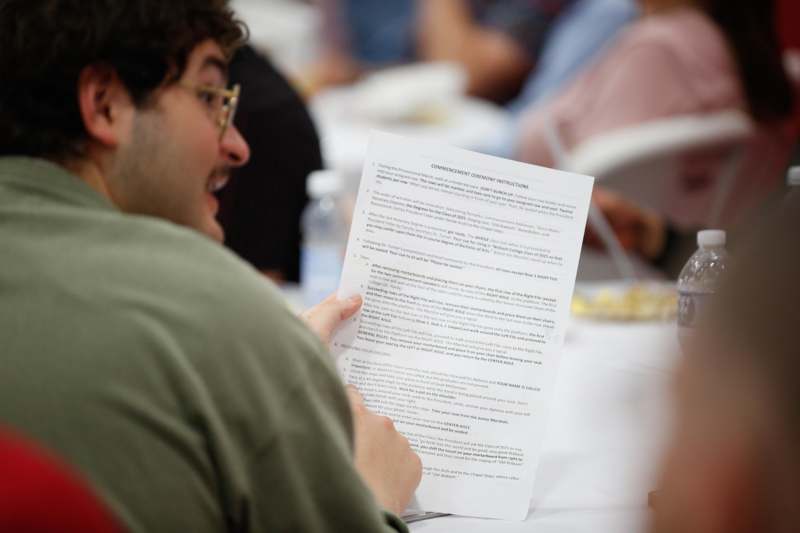 a man holding a piece of paper