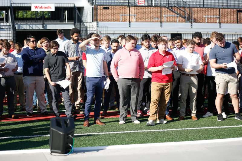 a group of people standing on a field