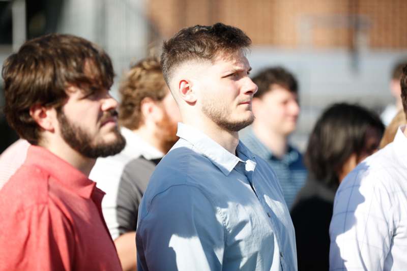 a group of men standing in a line