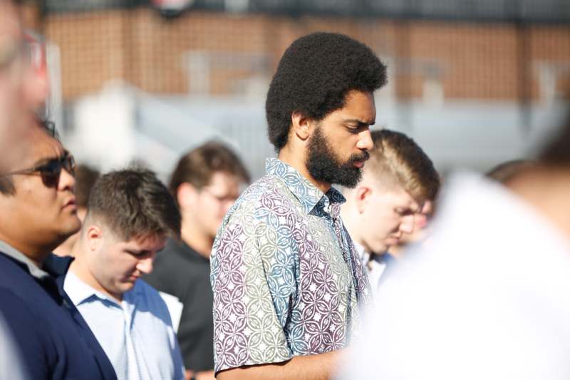 a group of men standing in a line