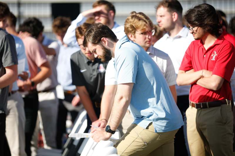 a group of people standing in a line