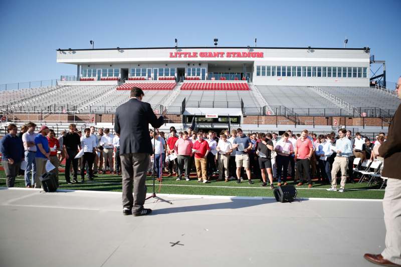 a man standing in front of a crowd of people