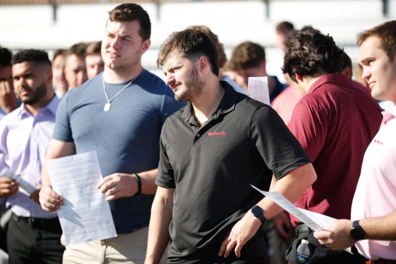 a group of men standing in a crowd