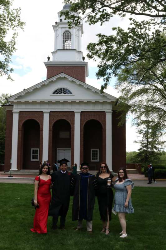 a group of people standing in front of a building