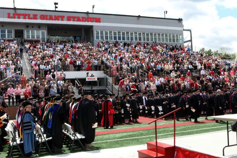 a group of people in graduation gowns