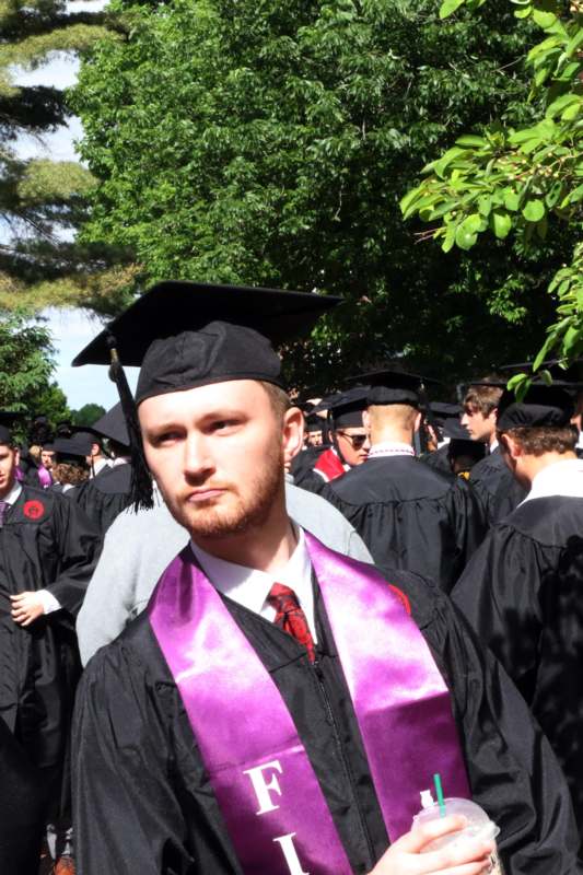 a man in a graduation gown