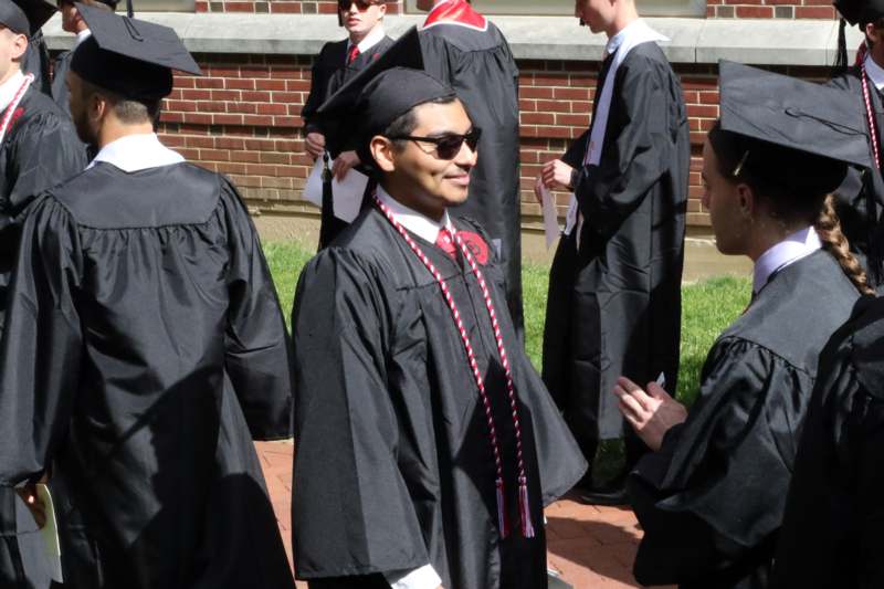 a group of people wearing graduation gowns