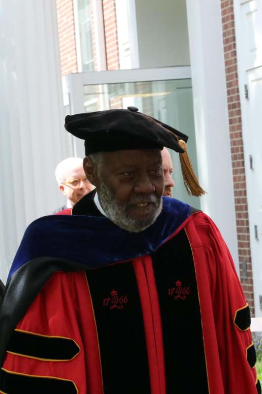 a man in a graduation gown