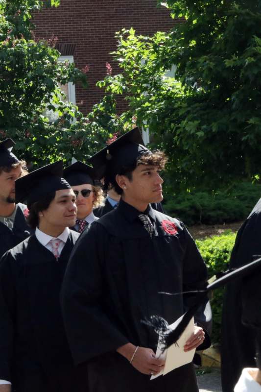 a group of people in graduation gowns